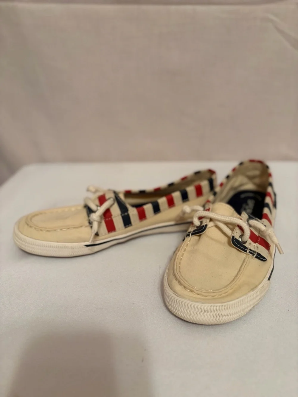Sperry Lounge Away sneakers in a natural, red, and blue stripes